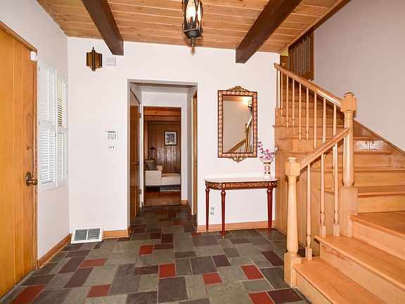 Inviting foyer leading to Living Room or den/office or upstairs to the bedrooms.