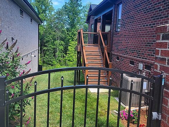 Fenced yard & view of woods