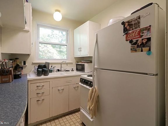 kitchen with picturesque views of the serene wooded surroundings.