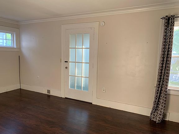 Living room (door to fully enclosed porch with new windows)