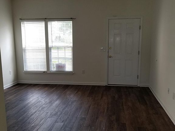 Living room with brand new luxury plank flooring and freshly painted interior.