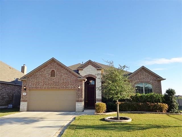 This home has a three car garage behind this garage door!