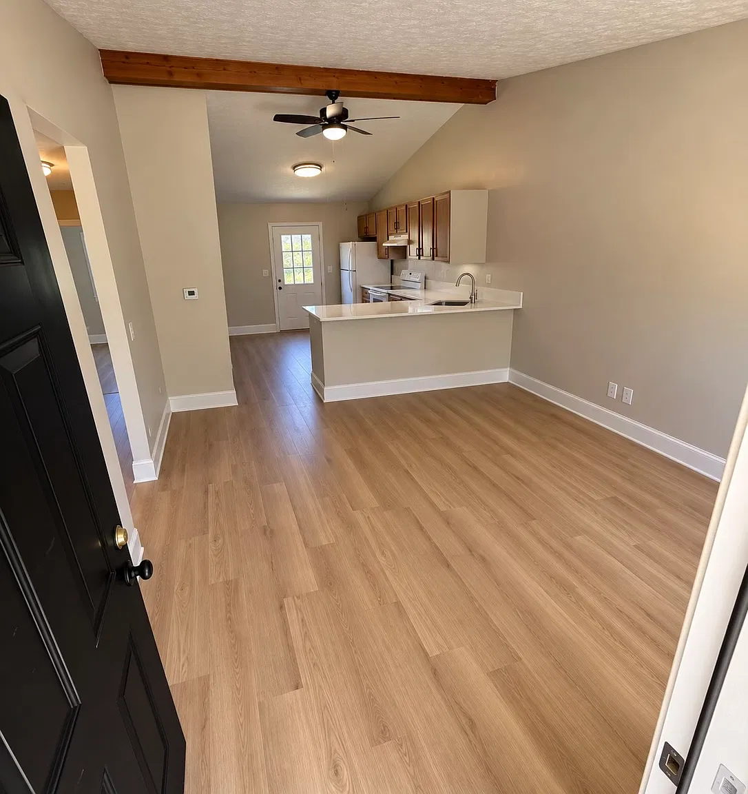 Open concept living and kitchen area with vaulted ceilngs!