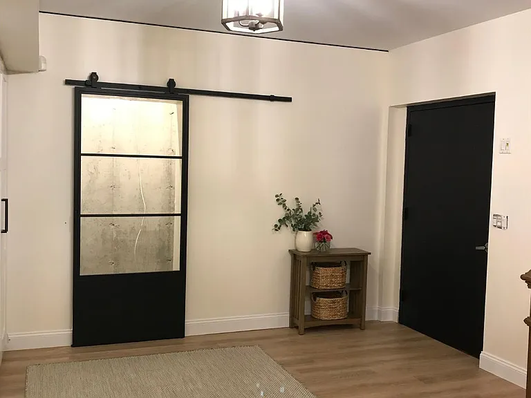 Entrance from garage with wine storage room