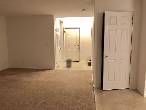 Front door entry. 
Coming into the house you left to go upstairs. 
Go right, there is the downstairs bathroom. 
The door on the left you see is a closet.