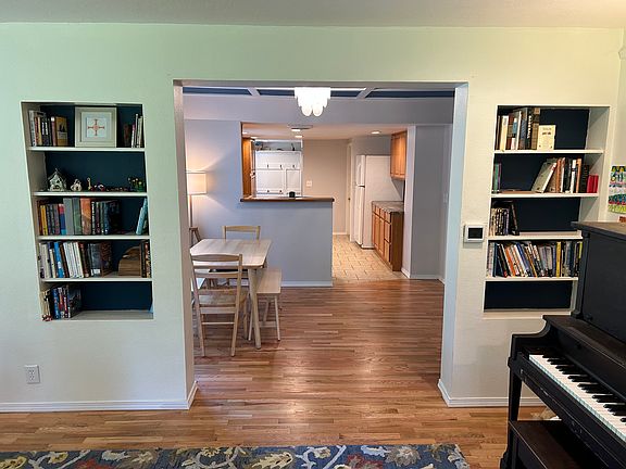 Living room looking into dining room and kitchen