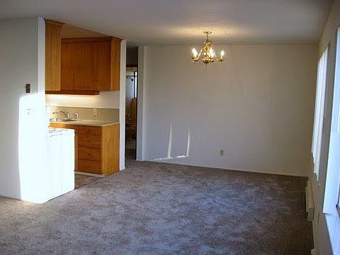 Living looking towards dining area and back bedroom