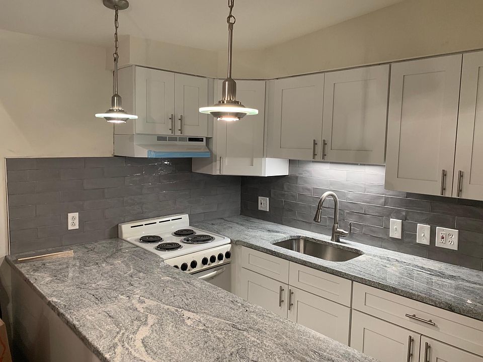 Top grade granite, lots of modern shaker style upgraded cabinets.