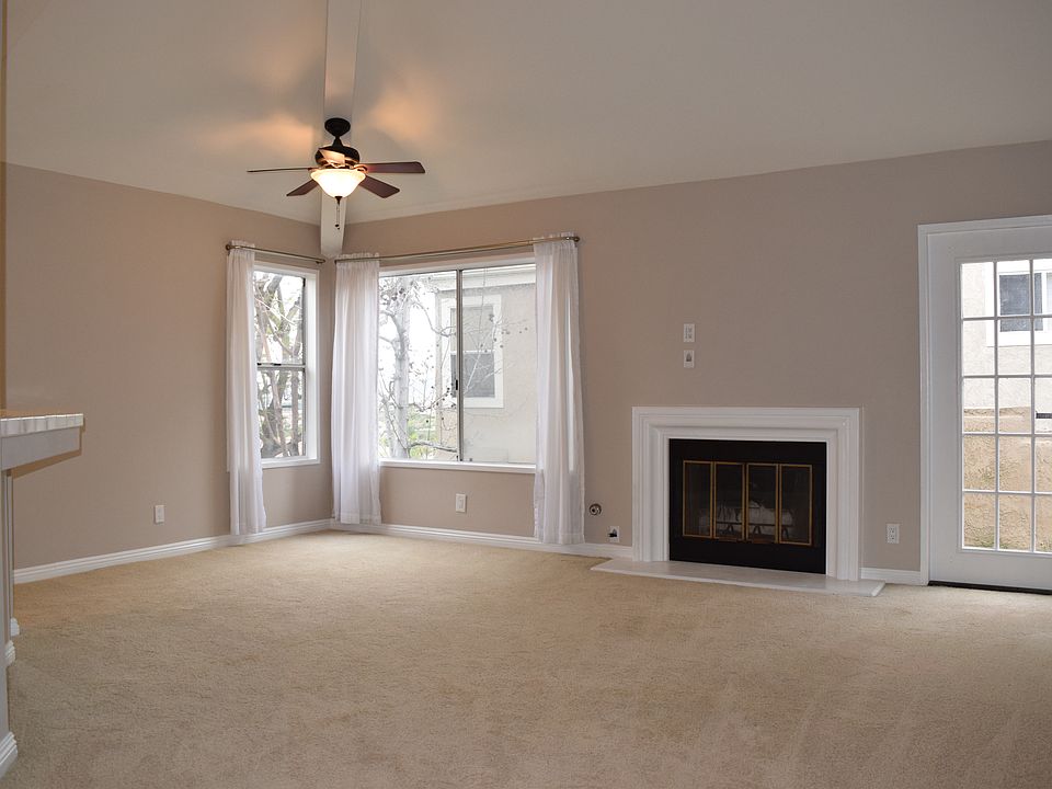 Open plan living & dining with direct access to balcony. Newer carpet & paint since this photo