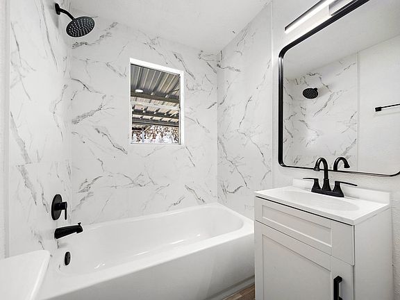 Shared hallway bathroom 1 with window.