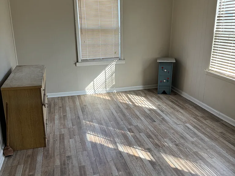 Large bedroom overlooking back yard.