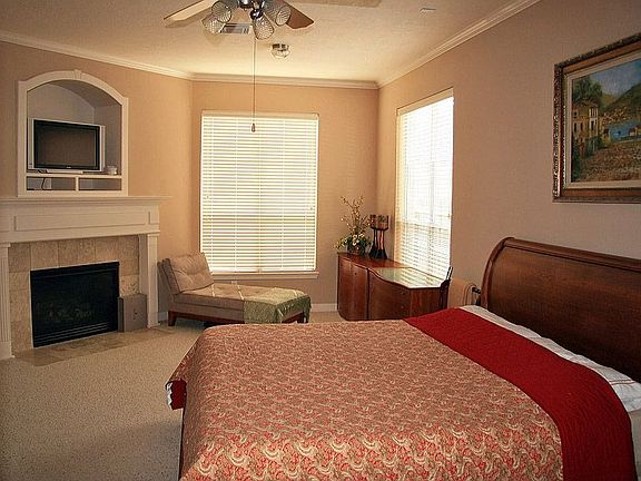 Master suite with sitting area and fire place