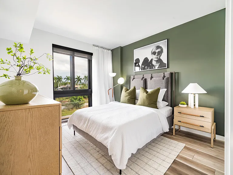 Create your dream bedroom at Modera Aventura, where warm finishes, natural light, and palm-lined views create a relaxed, inviting retreat.