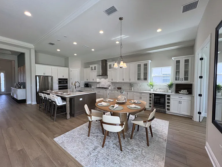 Kitchen with large island that seats 4 and room for table for 6.