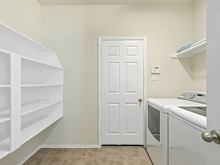 This pantry is a dream! Spacious for housing goodies and treats and includes luxury washer and dryer!