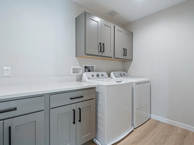 Laundry Room with Washer/Dryer, lots of Cabinets, and Folding Area
