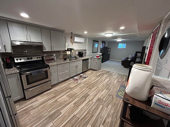 Full kitchen with laundry in unit.