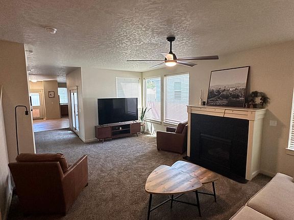 living room down stairs with 70'' TV