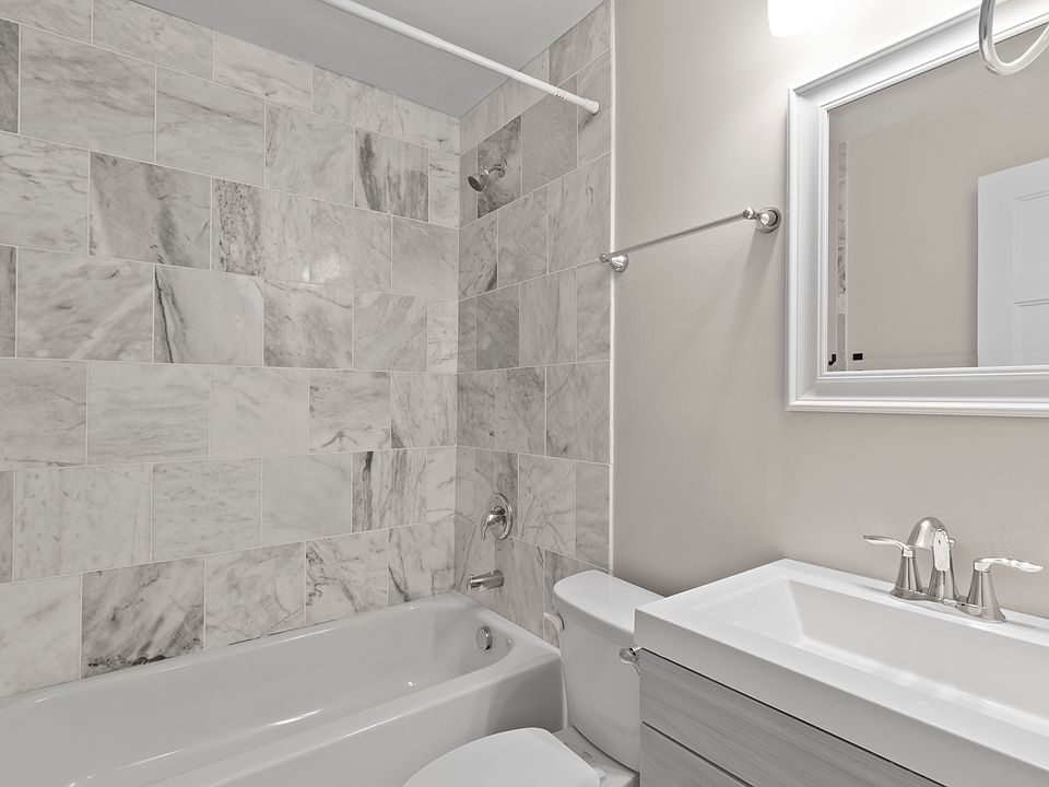The bathroom was fully updated in neutral tones.