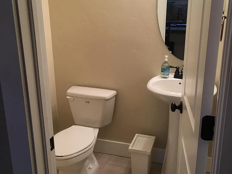 1/2 bath (located across from the kitchen and next to the back living room)