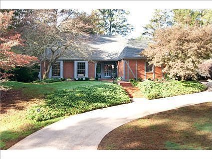 Stunning setting for this brick home