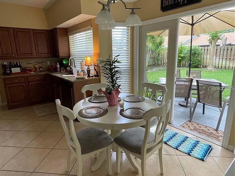 EAT IN KITCHEN OPEN TO FRENCH DOORS OVER LOOKING THE BACK YARD