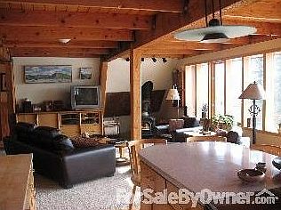 warm wood ceilings, lots of light & VIEW : Light and bright throughout this home. Custom built-in en