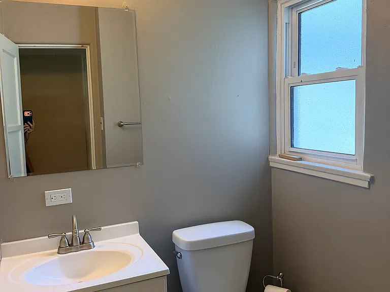 Bathroom has recently updated shower, sink, and toilet, carefully maintained and very clean
