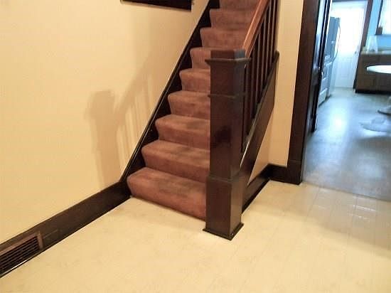 As friends and family come through the front door, they will see the natural woodwork, door frame and impressive natural wood ra
