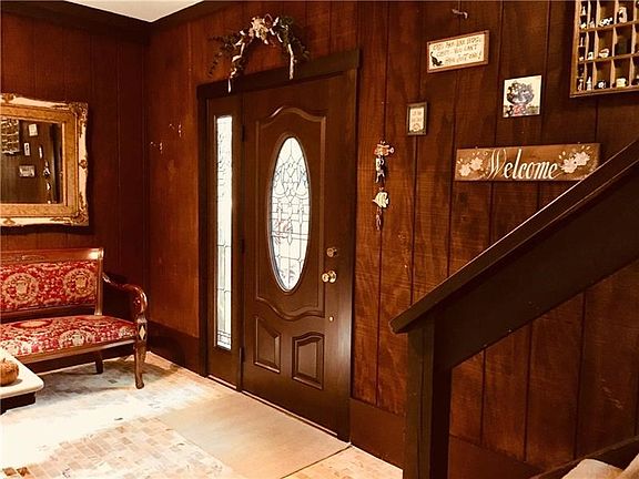 ENTRY Newer Pella door, limestone floor and cedar paneling.  Great entry with plenty of room.