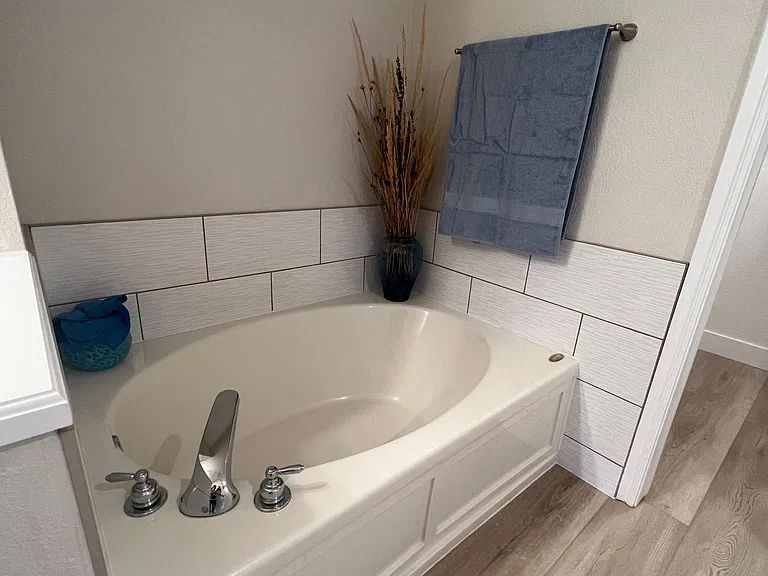 Nice soaker tub in primary bathroom.