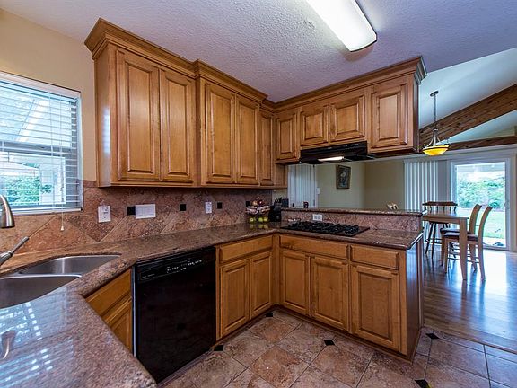 42â custom cabinets, granite counters, two depth stainless sink with touchless faucet.