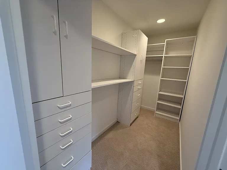 Second bedroom has ceiling fan, spacious walk-in closet and comfortable plush carpet.