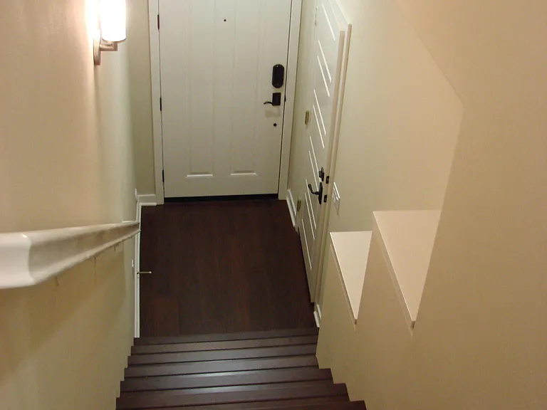 Stairs leading down to front entrance and garage