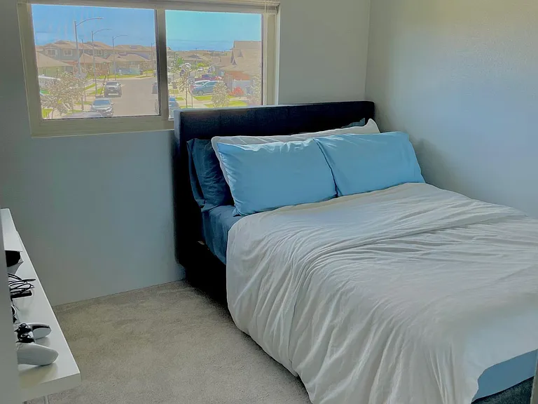 Bedroom 2 with front house view.