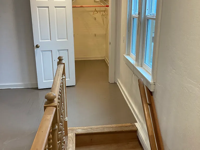 Stairway to second floor, showing clothes closet