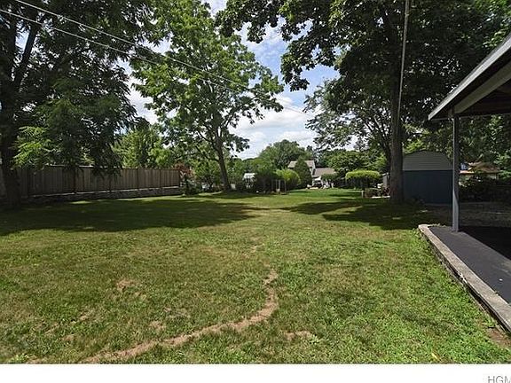 Large flat backyard for warm weather entertaining.