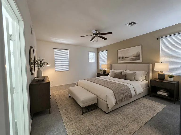 Primary suite with two walk-in closet, extra linen closet and main bathroom. Virtually staged.