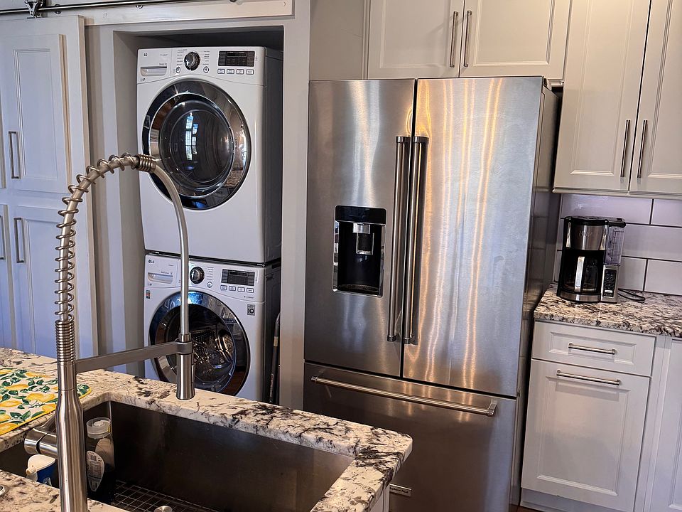 kitchen with laundry and stainless appliances