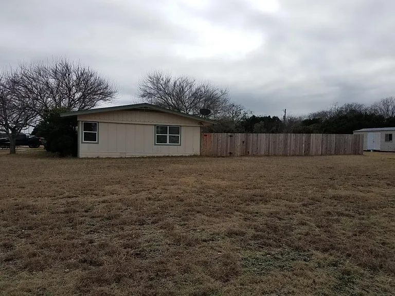 Side view with storage shed in back