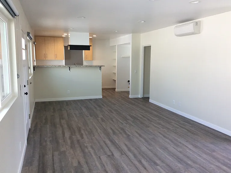 MINI-SPLIT AIR CONDITIONING SYSTEM IN THE LIVING ROOM AND EACH BEDROOM.