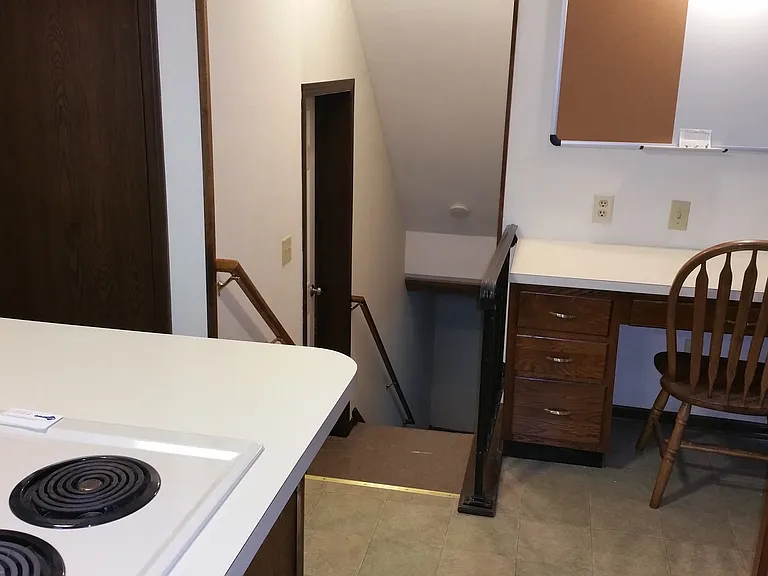 Steps to lower level and desk area in Kitchen