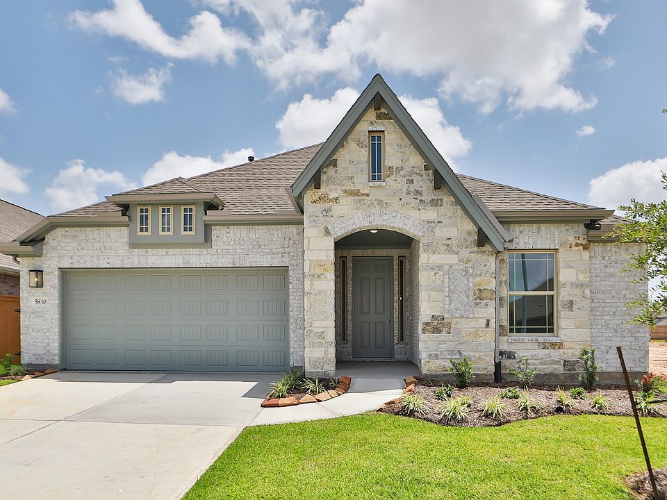 Experience elegance with a stone facade and arched entry in Sunterra. Meticulously designed for luxu