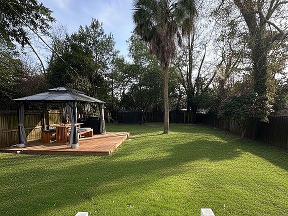 Private Backyard feature a brand new deck and storage area.