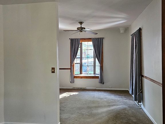 Dining area with living room in back ground