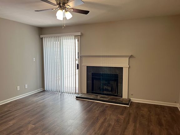 Living Room w/fireplace and sliding doors to private back patio.