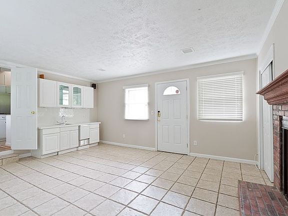 Den w/ Wetbar & Fireplace