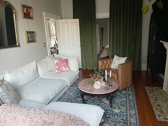 Original pocket doors connecting living room to primary bedroom