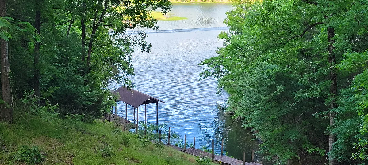 View from back porch, boat cover and large dock for swimming. - 15501 Marble Rd