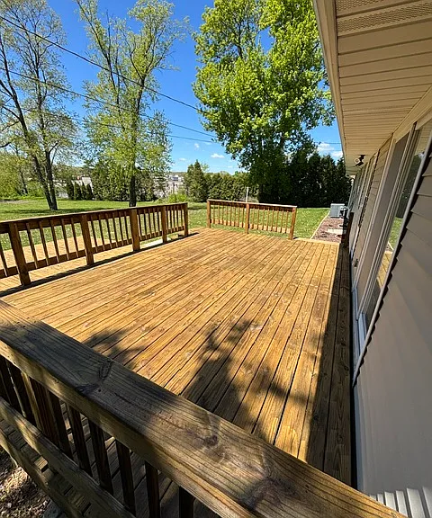 Large back deck freshly cleaned, stained and sealed
